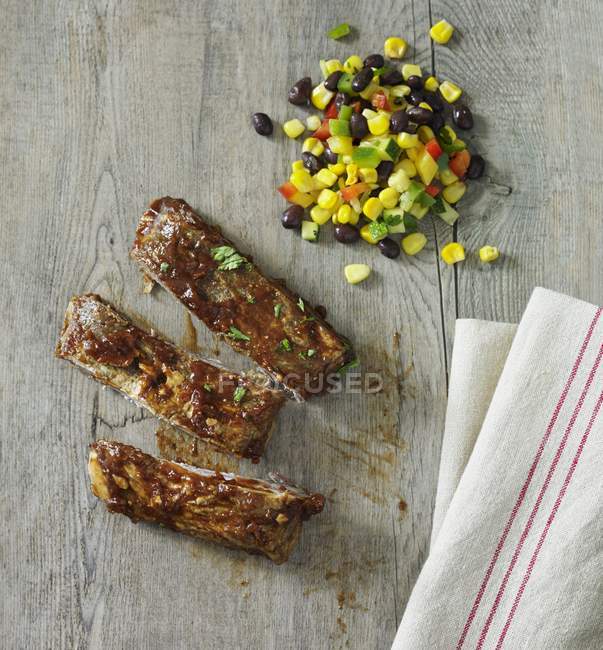 Spare ribs with bean and salad — Stock Photo
