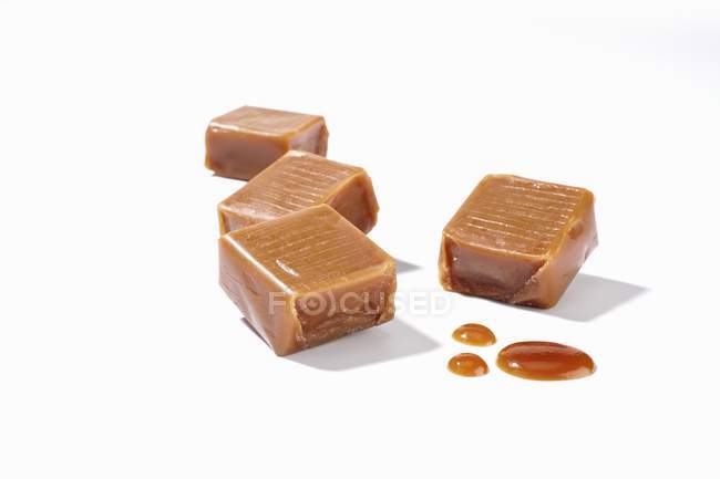 Four caramel bonbons — Stock Photo