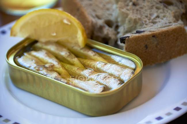 Tin of sardines with lemon — Stock Photo