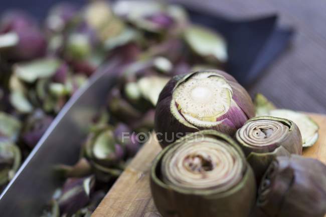 SashFresh pieces of artichokes on white surfacea — Stock Photo
