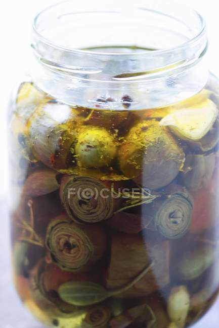 Pickled baby artichokes and capers — Stock Photo