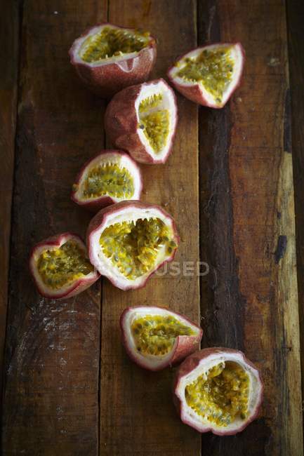 Halved fresh passion fruits — Stock Photo