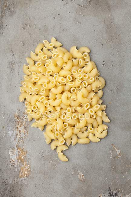 Dry uncooked pile of chifferi pasta — Stock Photo