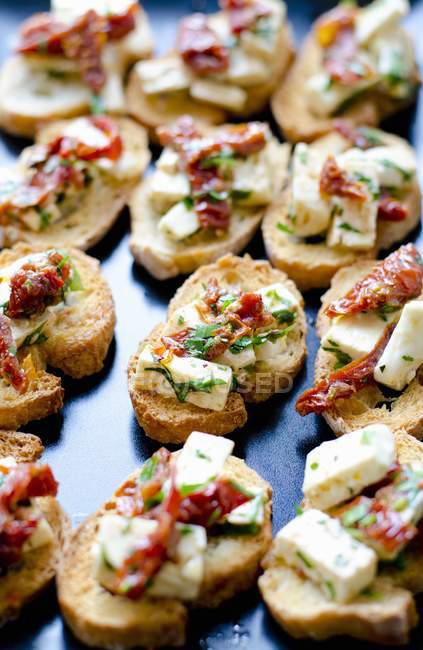 Bruschetta with feta cheese — Stock Photo