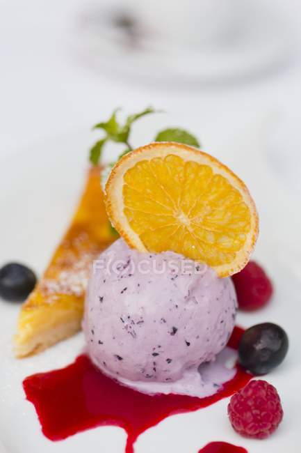Blueberry ice cream with candied oranges — Stock Photo