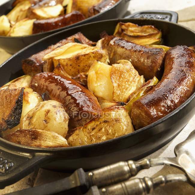 Swiss sausages with apples — Stock Photo