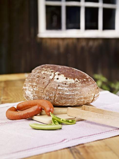 Whole loaf of wholemeal rye bread — Stock Photo