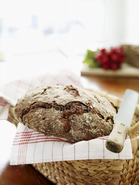 Loaf of three-grain bread — Stock Photo