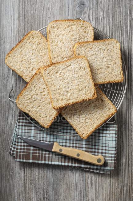 Slices of bread on rack — Stock Photo