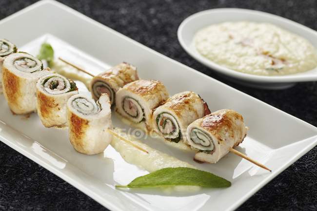 Stuffed pork roll skewers with pear mousse — Stock Photo