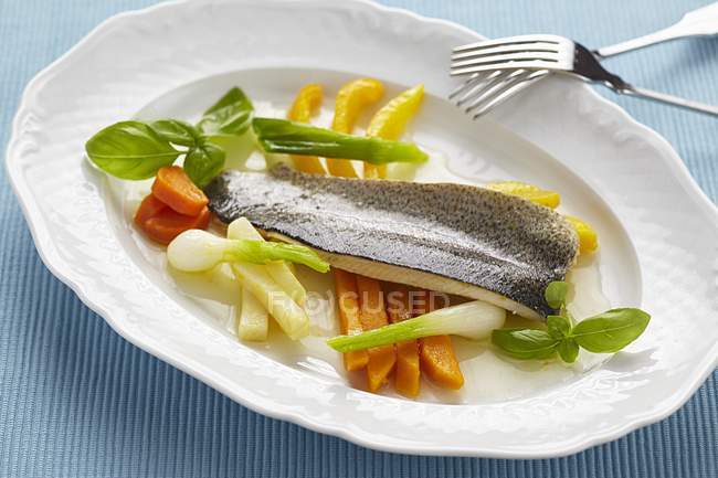 Poached trout with glazed vegetables — Stock Photo