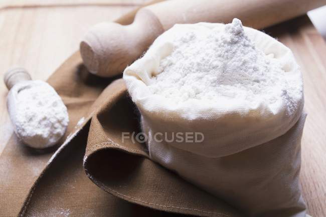 White flour in linen sack — Stock Photo
