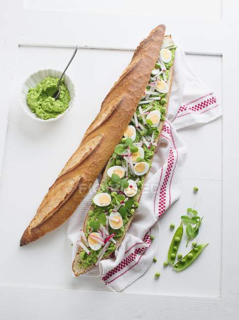 Baguette with avocado and cream — Stock Photo