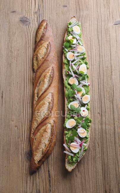 Baguette with avocado and cream — Stock Photo