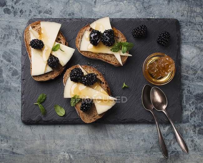 Bruschetta topped with cheese — Stock Photo