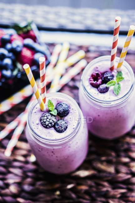 Berry smoothies in jars — Stock Photo