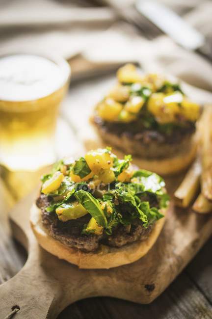 Grilled cheeseburgers with beer — Stock Photo