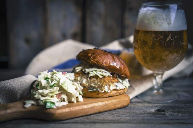 Rustic fish burger with coleslaw — Stock Photo