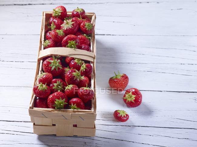 Strawberries in wooden basket — Stock Photo