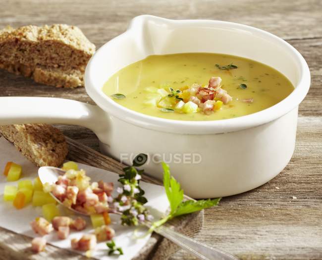 Lusatian potato soup with chasseur sausage in white dish — Stock Photo