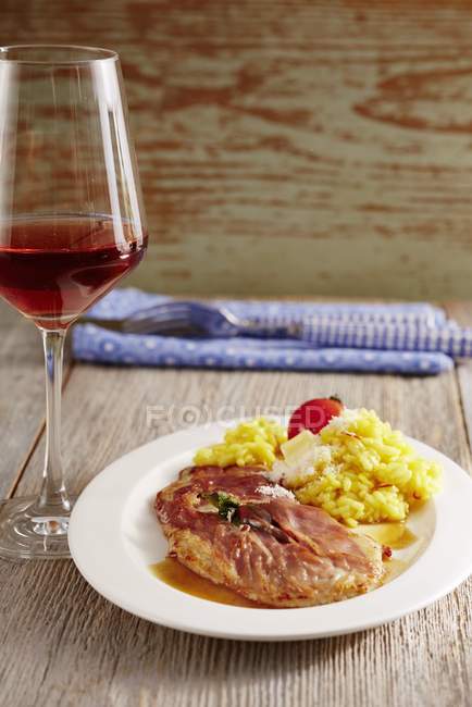 Saltimbocca with risotto  on plate — Stock Photo