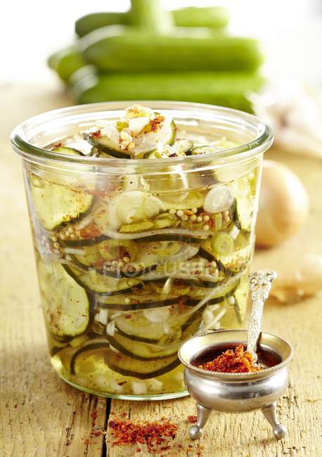 Cucumber salad in glass with spices — Stock Photo