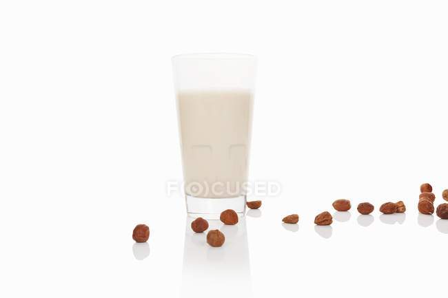 Glass of hazelnut milk — Stock Photo