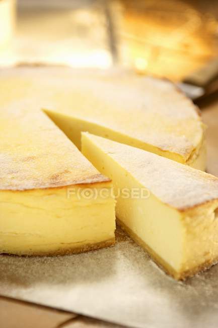 Cheesecake with pieces removed — Stock Photo