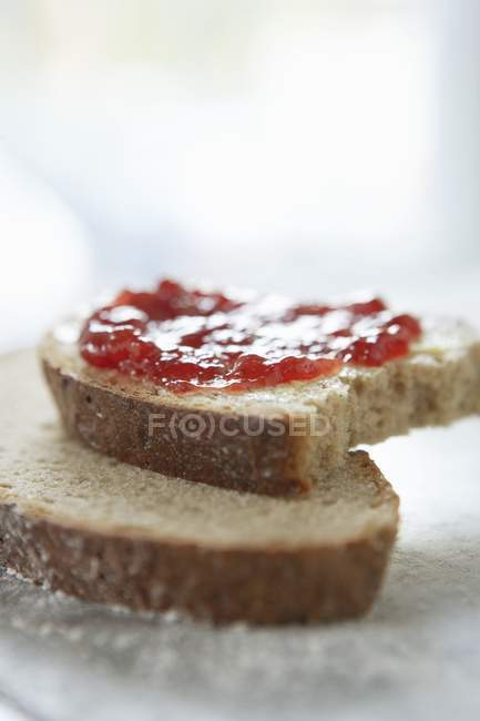 Slices of rye bread spread — Stock Photo
