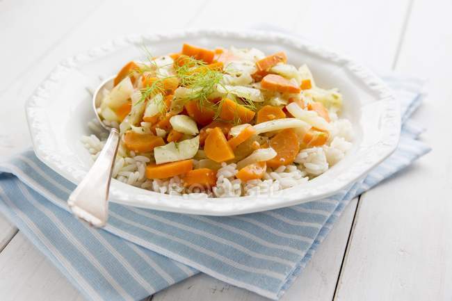 Fennel and carrot medley on rice — Stock Photo