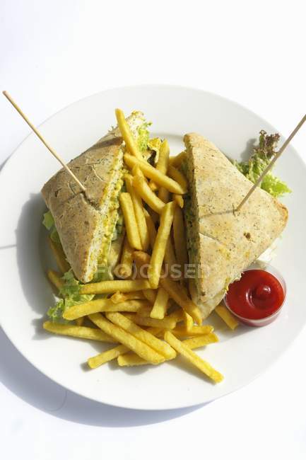 Club sandwich with chips — Stock Photo