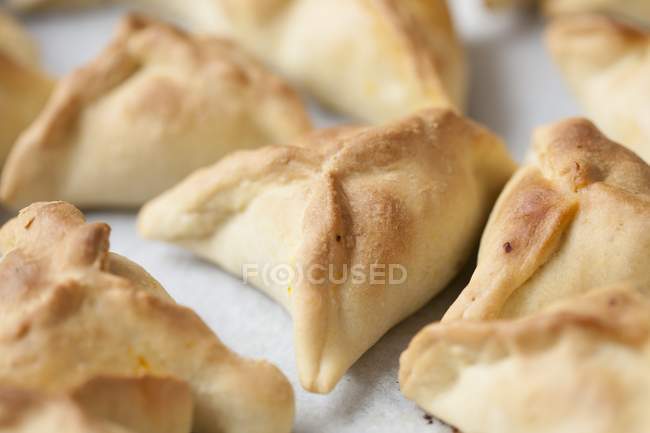 Fataya - pastry parcels filled butternut squash on white surface — Stock Photo