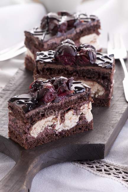 Chocolate cakes with cherries and meringue — Stock Photo