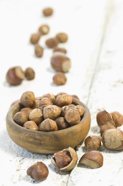 Hazelnuts in wooden bowl — Stock Photo