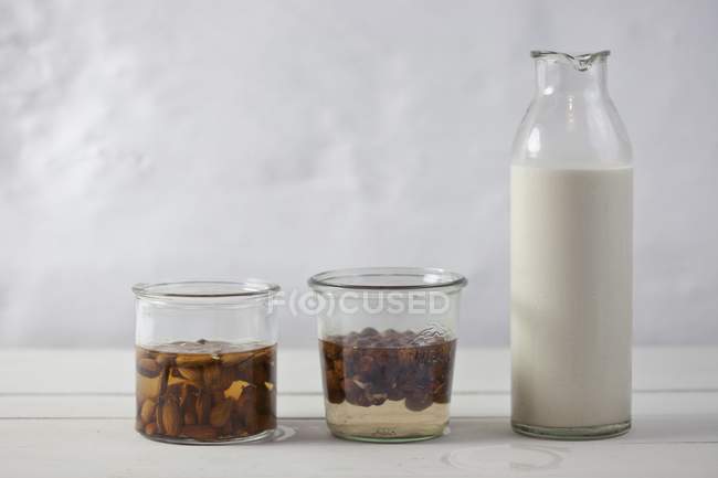 Almonds softened in water — Stock Photo