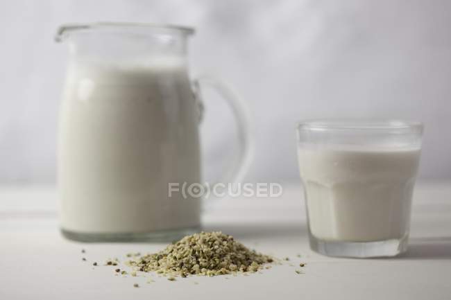 Hemp milk and seeds — Stock Photo