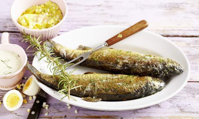 Fried trout with rosemary — Stock Photo