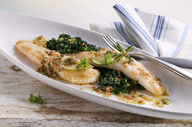 Pangasius fillet in butter — Stock Photo