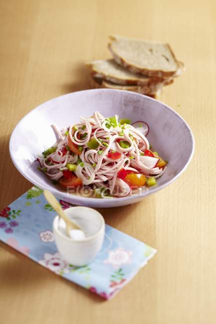 Sausage salad with pepper and radishes — Stock Photo