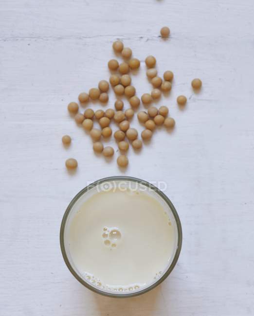 Soya beans and glass — Stock Photo