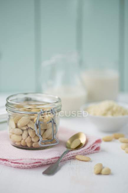 Jar of shelled almonds — Stock Photo
