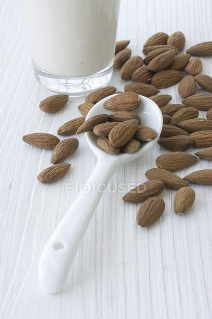 Almonds and almond milk — Stock Photo