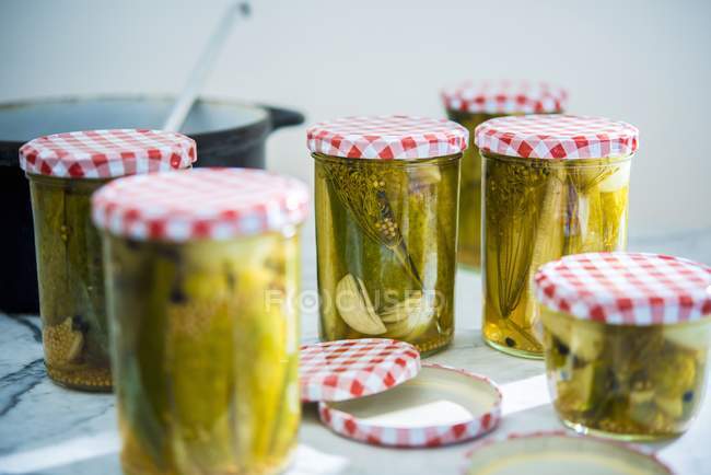 Jars of pickled gherkins — Stock Photo