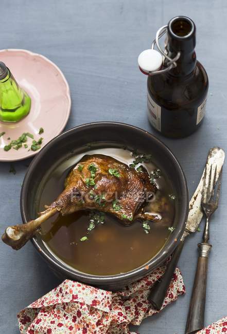 Elevated view of goose leg in beer broth — Stock Photo