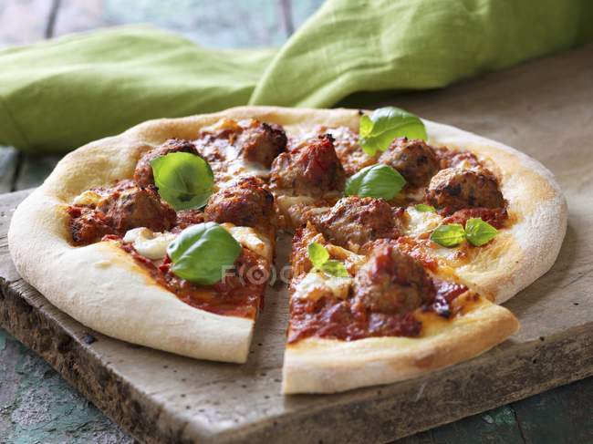 Meatball pizza on board — Stock Photo