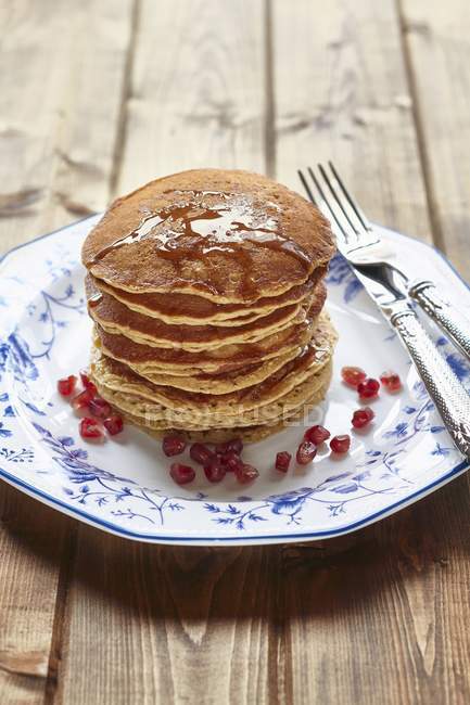 Stack of pancakes with honey — Stock Photo