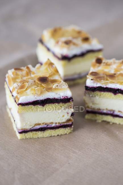 Slices of almond cream cake — Stock Photo