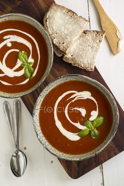 Tomato soup with cherry and basil — Stock Photo