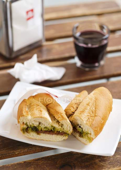 Baguette sandwich and wine — Stock Photo