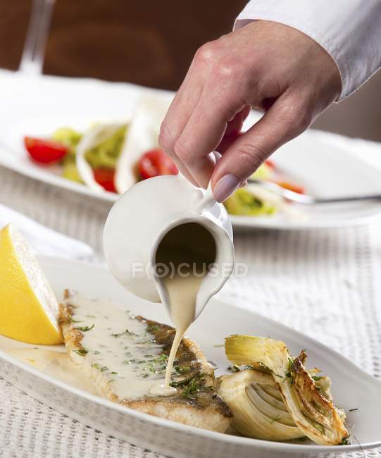 Sauce being poured — Stock Photo